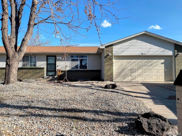 3190 S Joplin Ct, Aurora, CO 80013 - ranch-style home with brick siding, a garage, and concrete driveway