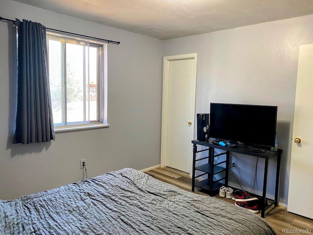 3190 S Joplin Ct, Aurora, CO 80013 - bedroom with wood finished floors and baseboards