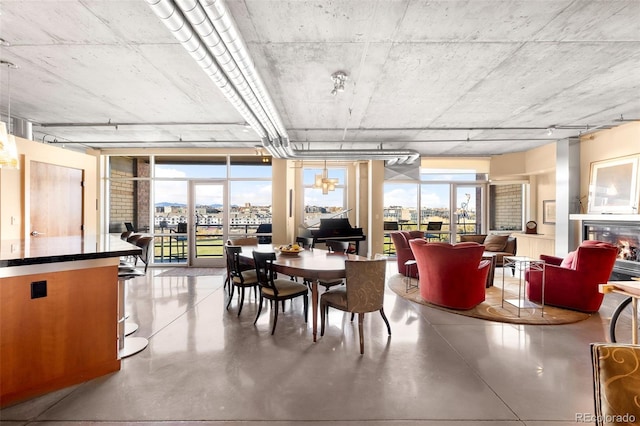 dining space with concrete flooring