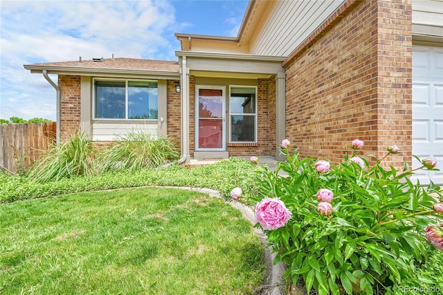 11149 Seton Pl, Westminster, CO 80031 - view of exterior entry featuring brick siding and a garage