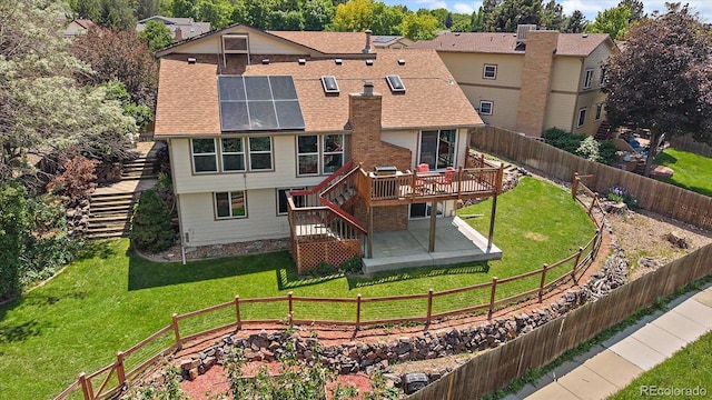 11149 Seton Pl, Westminster, CO 80031 - rear view of property featuring stairway, a patio, a wooden deck, a fenced backyard, and roof mounted solar panels
