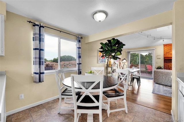 11149 Seton Pl, Westminster, CO 80031 - dining space featuring baseboards and rail lighting