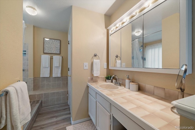 11149 Seton Pl, Westminster, CO 80031 - bathroom with vanity, a shower with shower curtain, and wood finished floors