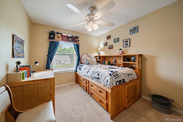 11149 Seton Pl, Westminster, CO 80031 - bedroom with light carpet, a textured ceiling, and a ceiling fan