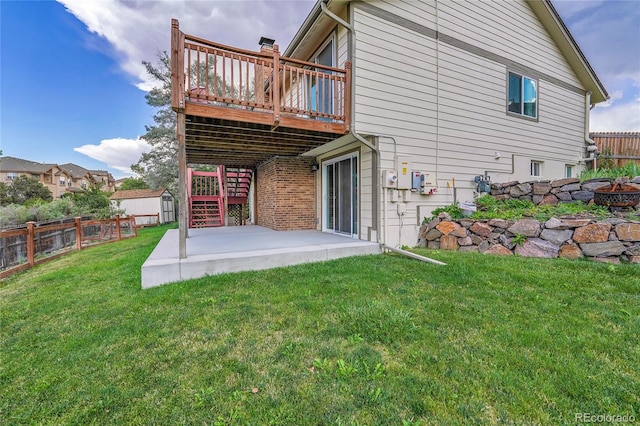 11149 Seton Pl, Westminster, CO 80031 - back of house featuring a wooden deck, a fenced backyard, an outdoor fire pit, and a patio