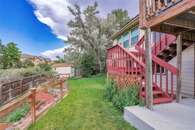 11149 Seton Pl, Westminster, CO 80031 - view of yard featuring a vegetable garden, a shed, stairway, and a deck