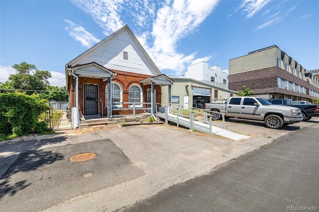 3907 Inca St Unit 3905, Denver, CO 80211 - view of front facade with a porch and brick siding