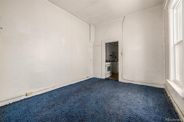 3907 Inca St Unit 3905, Denver, CO 80211 - spare room featuring dark carpet