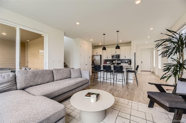 8982 Spaulding St, Parker, CO 80134 - living room with recessed lighting, light wood-type flooring, and stairs