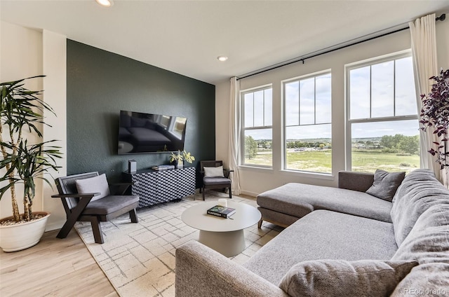 8982 Spaulding St, Parker, CO 80134 - living area featuring light wood finished floors and recessed lighting