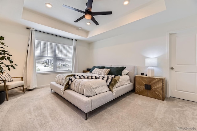 8982 Spaulding St, Parker, CO 80134 - bedroom featuring light colored carpet, a tray ceiling, recessed lighting, baseboards, and a ceiling fan