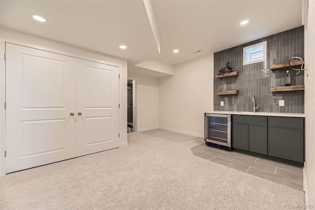 8982 Spaulding St, Parker, CO 80134 - indoor wet bar with wine cooler, light carpet, recessed lighting, baseboards, and tasteful backsplash
