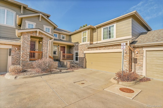 view of front of property with a porch and a garage