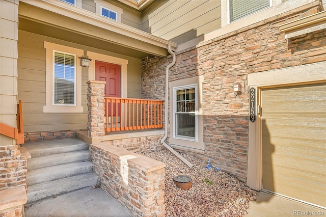 doorway to property with covered porch