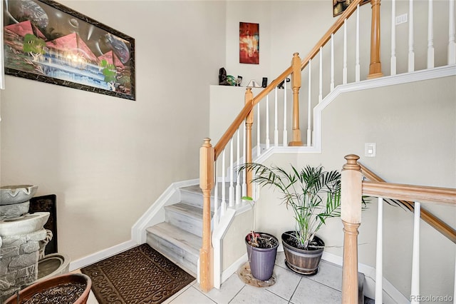 stairs with tile patterned flooring