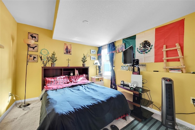 carpeted bedroom with a textured ceiling