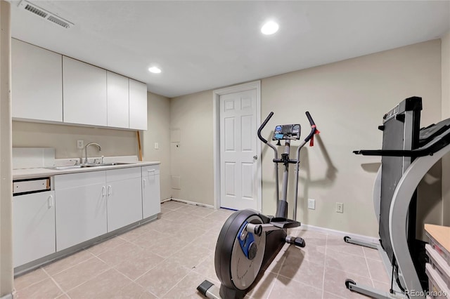 workout area with light tile patterned floors and sink