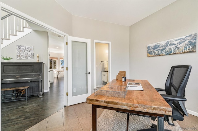 office space featuring tile patterned floors, french doors, and baseboards