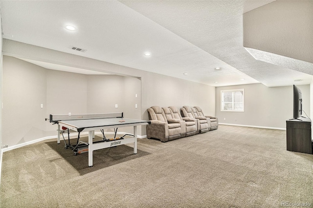 playroom with carpet flooring, baseboards, visible vents, and a textured ceiling