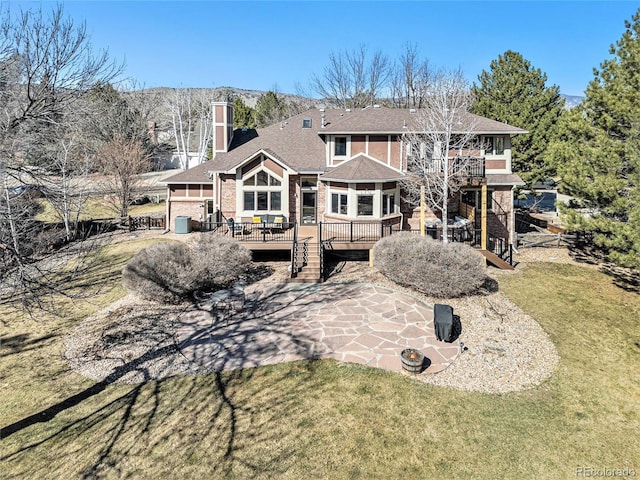 6406 Eagle Ct, Longmont, CO 80503 - back of house featuring a wooden deck, a chimney, stairs, a patio area, and a yard