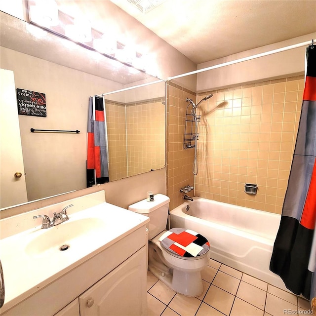 full bathroom with tile patterned flooring, vanity, toilet, and shower / bath combo with shower curtain