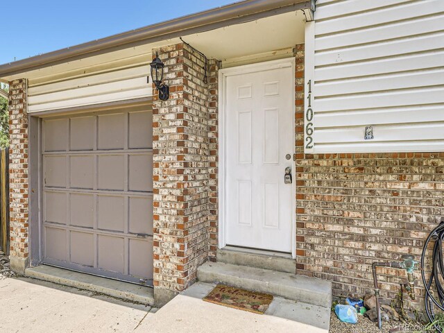 11062 Hudson Ct, Thornton, CO 80233 - view of exterior entry featuring brick siding