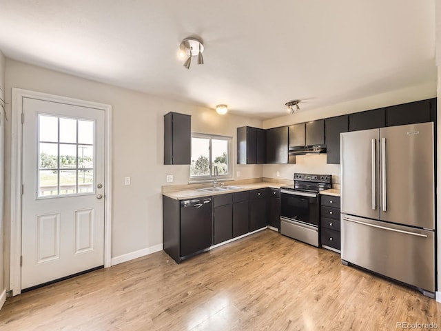 11062 Hudson Ct, Thornton, CO 80233 - kitchen with freestanding refrigerator, electric range oven, dishwasher, under cabinet range hood, and a sink