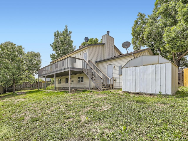 11062 Hudson Ct, Thornton, CO 80233 - rear view of property with a deck, stairs, and a chimney