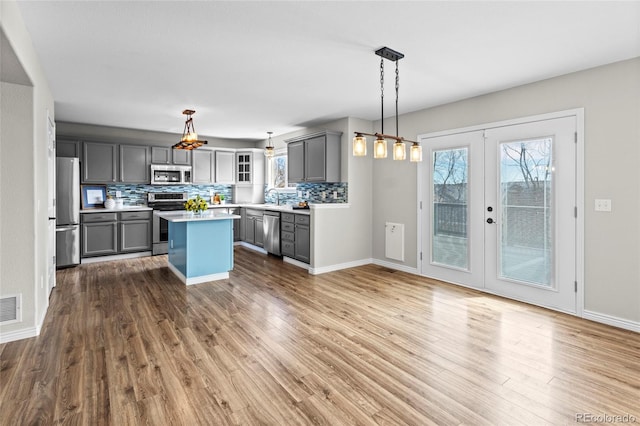 8414 Bed Straw St, Parker, CO 80134 - kitchen with appliances with stainless steel finishes, gray cabinetry, and plenty of natural light