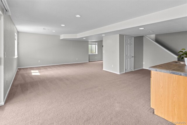 8414 Bed Straw St, Parker, CO 80134 - below grade area with recessed lighting, carpet floors, baseboards, and stairs