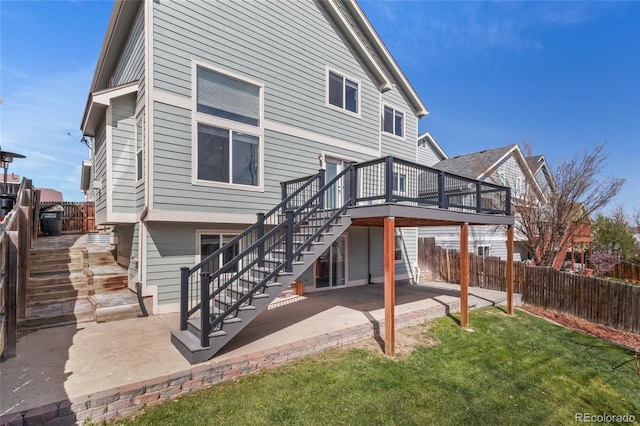 8414 Bed Straw St, Parker, CO 80134 - rear view of house featuring stairway, a patio area, and a wooden deck