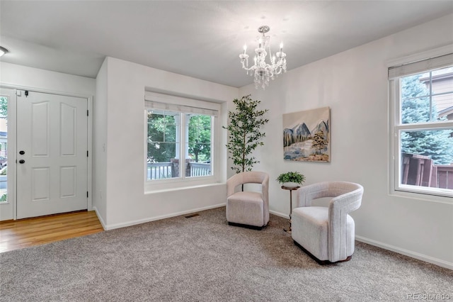 2430 S Jebel Way, Aurora, CO 80013 - living area with carpet flooring and a chandelier