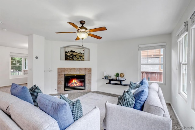 2430 S Jebel Way, Aurora, CO 80013 - carpeted living area featuring a fireplace and a ceiling fan