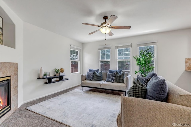 2430 S Jebel Way, Aurora, CO 80013 - carpeted living area featuring healthy amount of natural light, a ceiling fan, and a tile fireplace