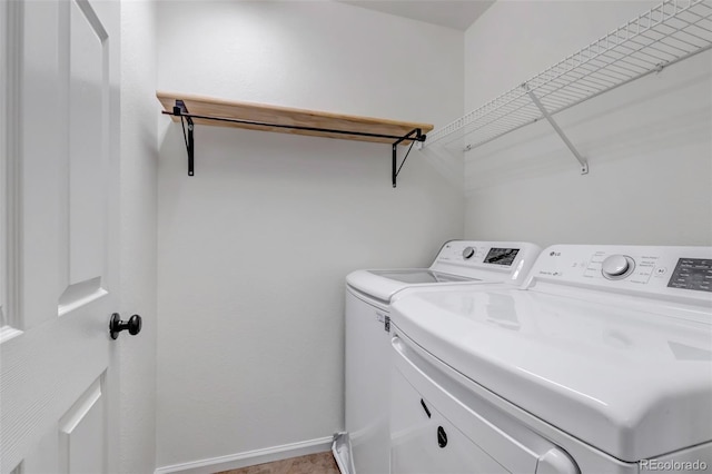 2430 S Jebel Way, Aurora, CO 80013 - laundry room featuring washer and clothes dryer and baseboards