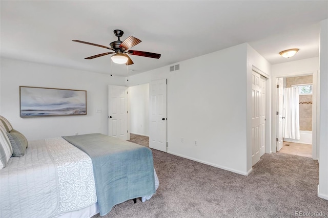 2430 S Jebel Way, Aurora, CO 80013 - carpeted bedroom featuring connected bathroom and ceiling fan