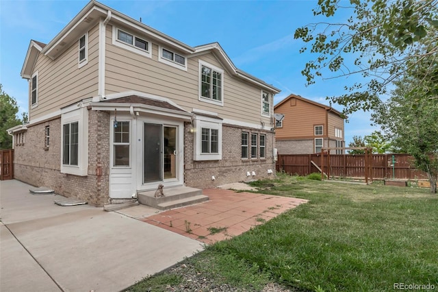2430 S Jebel Way, Aurora, CO 80013 - back of property featuring brick siding and a patio