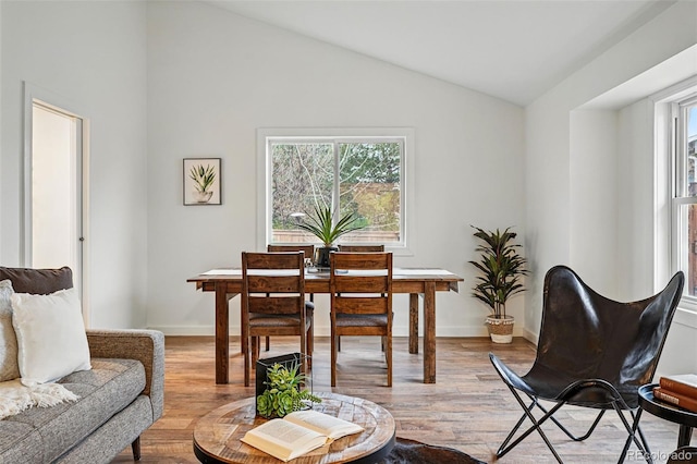 3053 Mcintosh Dr, Longmont, CO 80503 - dining space featuring vaulted ceiling and light wood finished floors