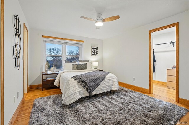 3053 Mcintosh Dr, Longmont, CO 80503 - bedroom with light wood-type flooring and a ceiling fan