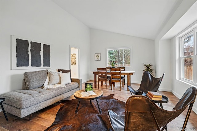3053 Mcintosh Dr, Longmont, CO 80503 - living area featuring wood finished floors and high vaulted ceiling