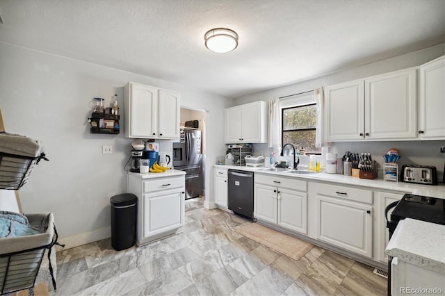 330 2nd St, Kersey, CO 80644 - kitchen featuring dishwashing machine, a sink, freestanding refrigerator, light countertops, and white cabinetry