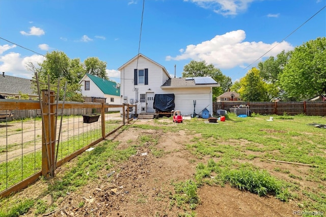 330 2nd St, Kersey, CO 80644 - rear view of property featuring roof mounted solar panels