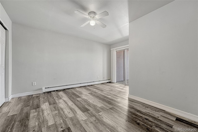 spare room with light wood-style floors, baseboards, baseboard heating, and a ceiling fan