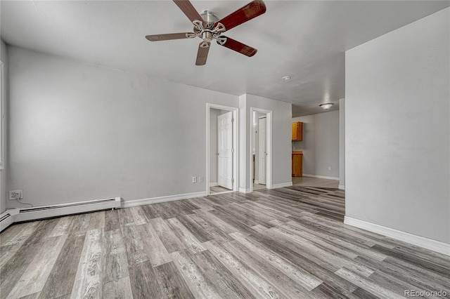 unfurnished room with light wood-style flooring, baseboards, and ceiling fan