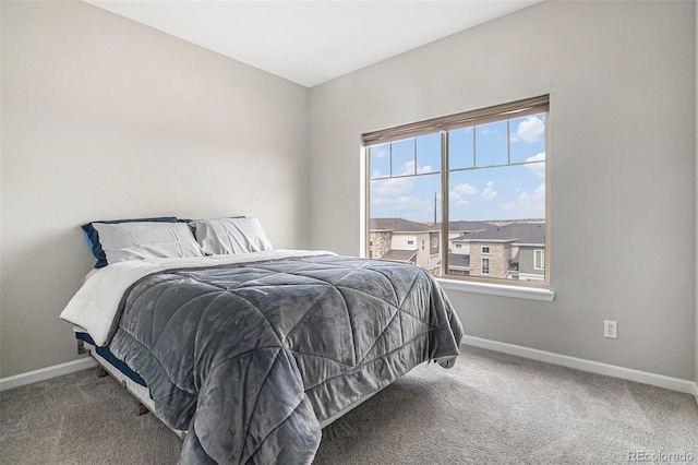 carpeted bedroom with baseboards