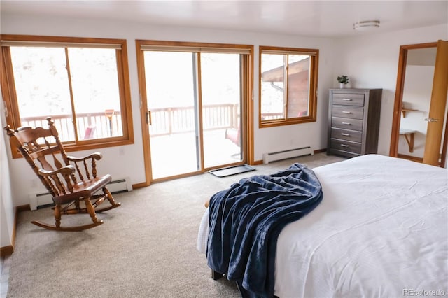 carpeted bedroom featuring baseboard heating and access to exterior