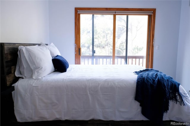 bedroom featuring access to outside and multiple windows