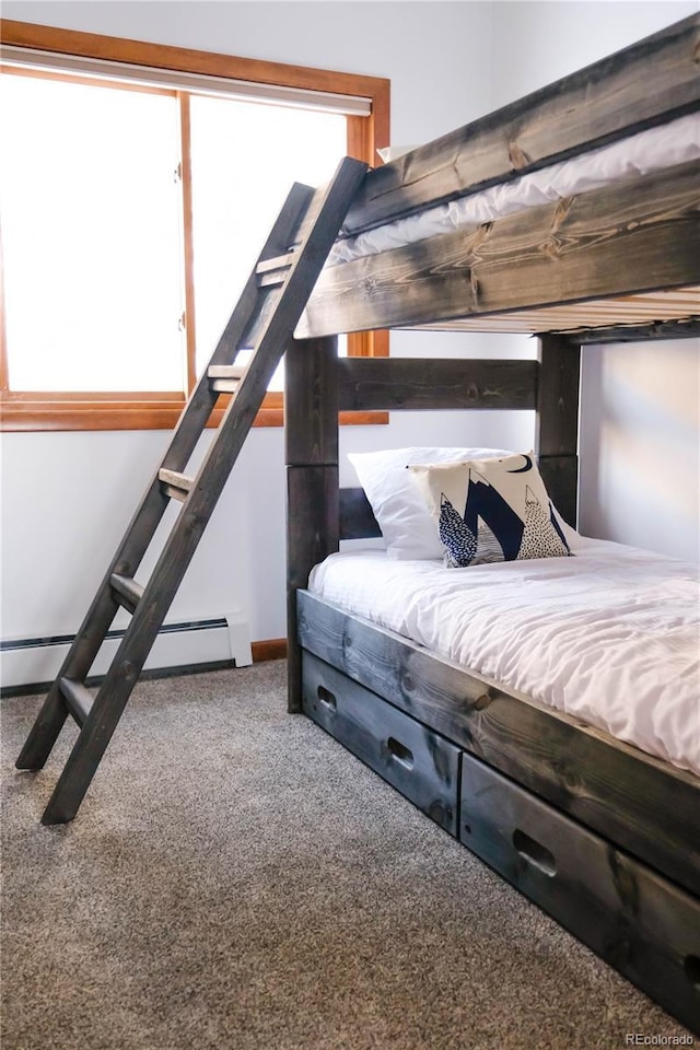 carpeted bedroom featuring a baseboard radiator