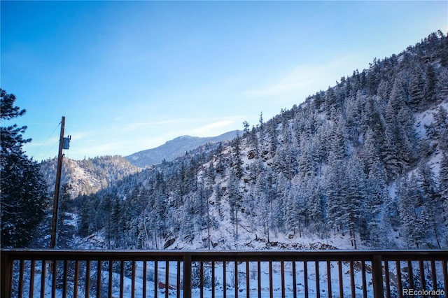 property view of mountains with a wooded view