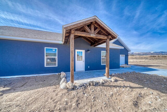 880 Hoover Cir, Poncha Springs, CO 81242 - exterior space with stucco siding and a patio area